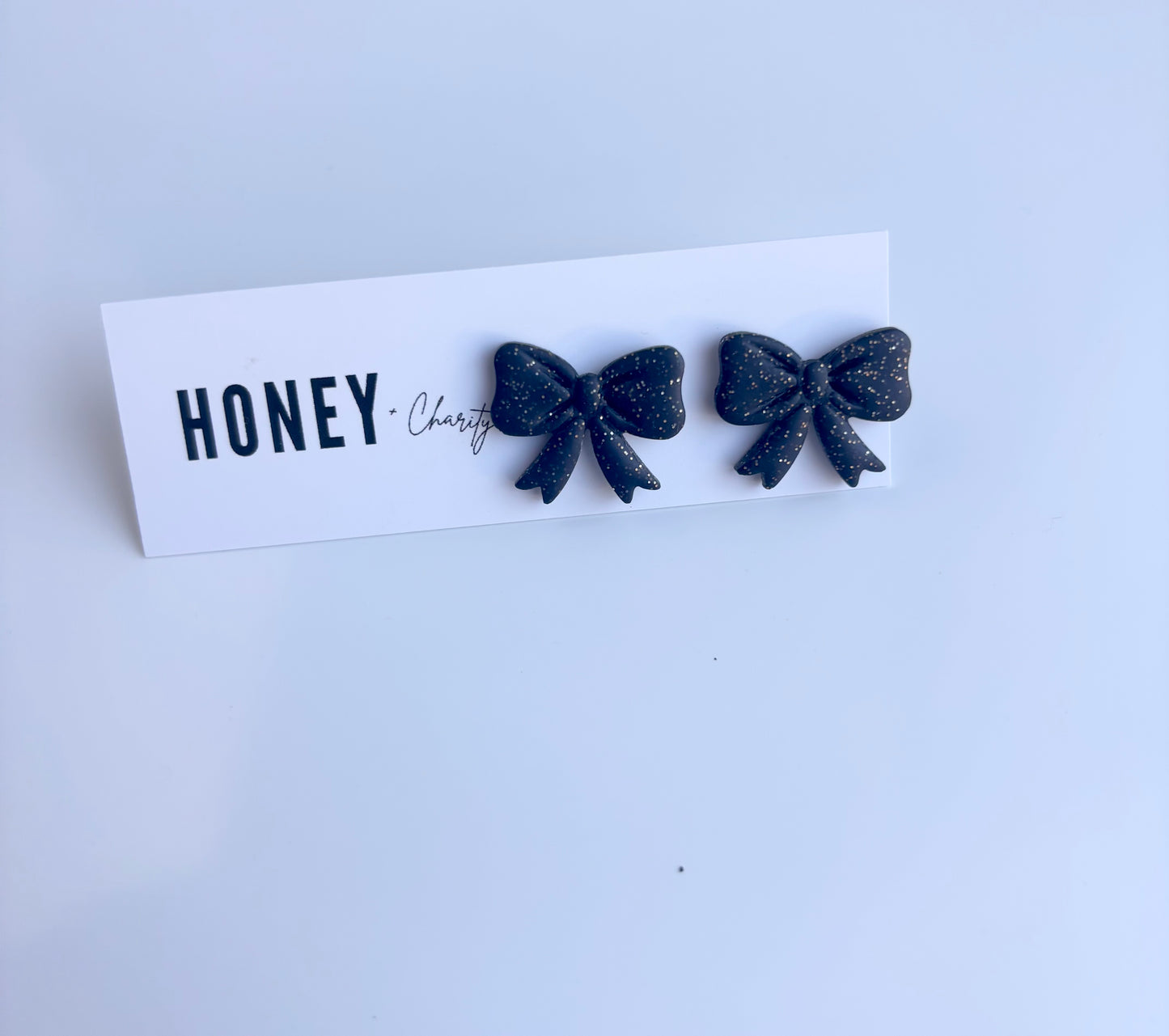 Black Sparkle Bow Studs